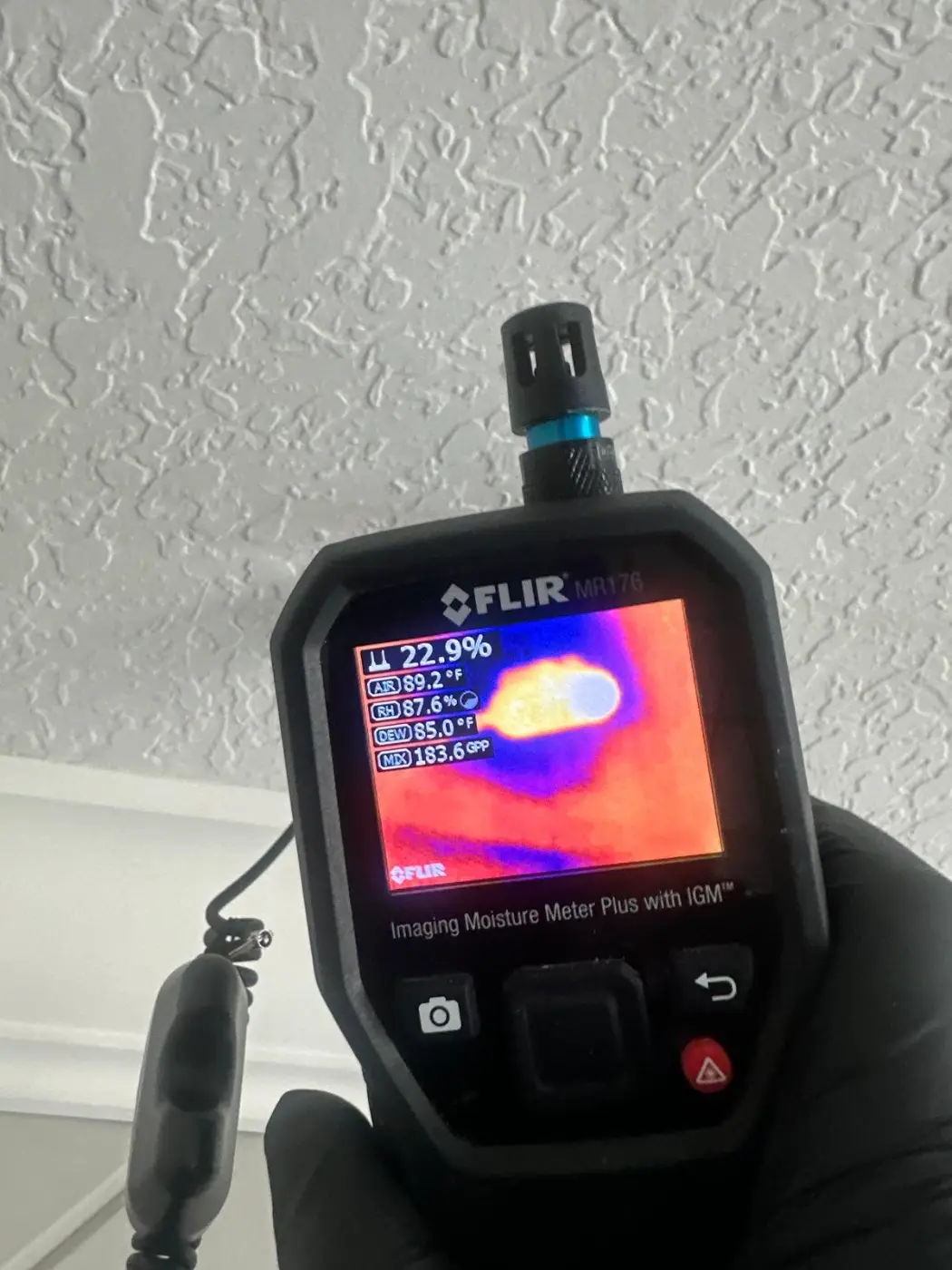 Thermal imaging camera showing a cold, wet patch on a ceiling